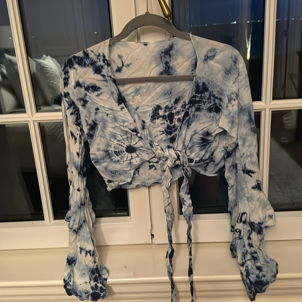Blue tie-dye wrapped long sleeve shirt with flared arm sleeves